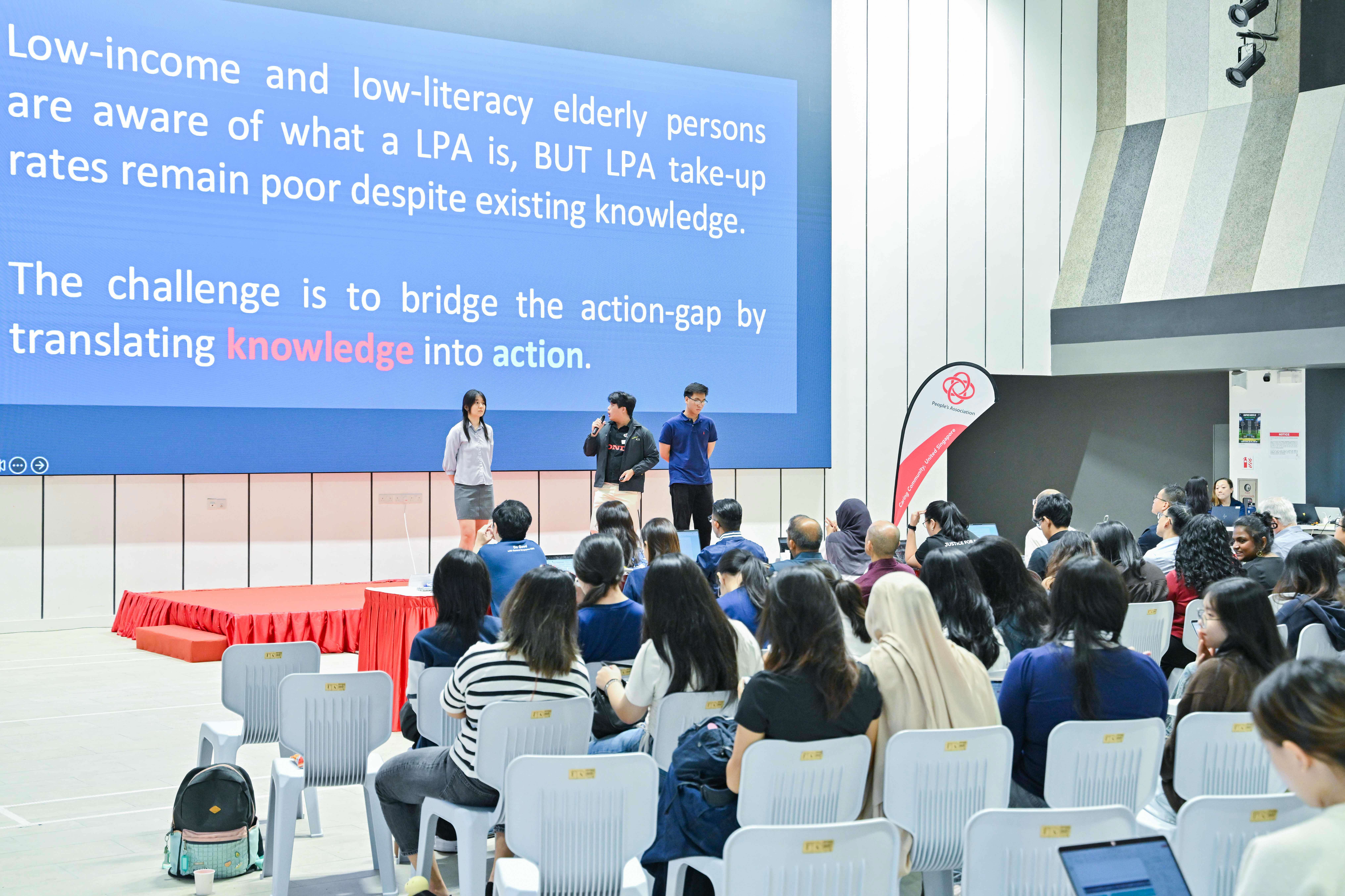 Three students explaining the main challenge of their project